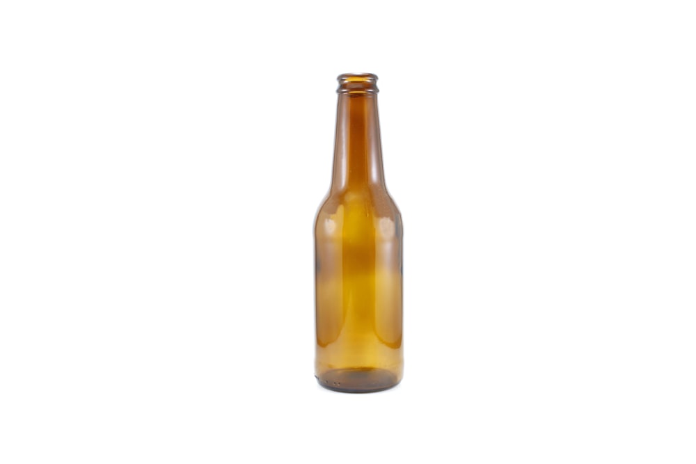 brown glass bottle with yellow liquid