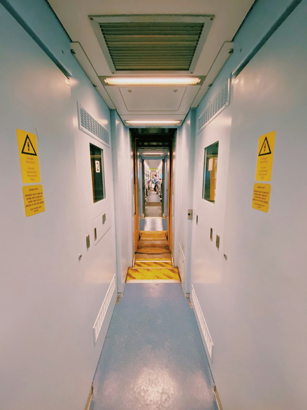 white concrete building with yellow door