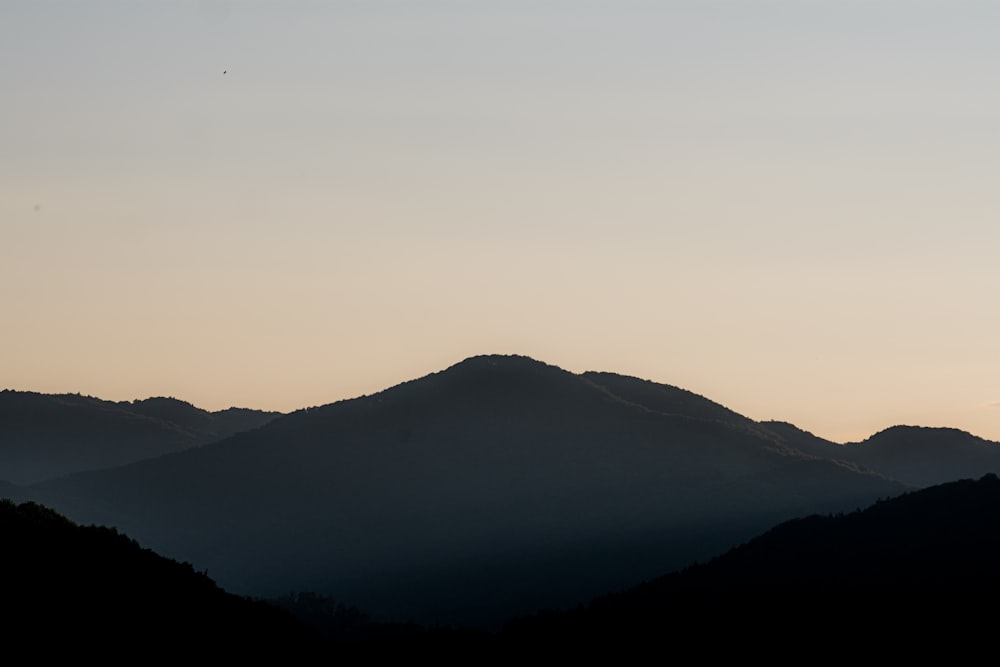 silhouette of mountain during sunset