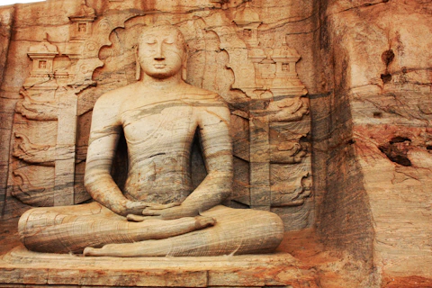 brown concrete statue of a woman