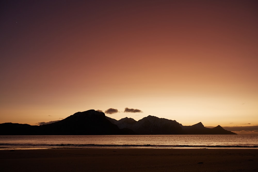 silhouette of mountains during sunset