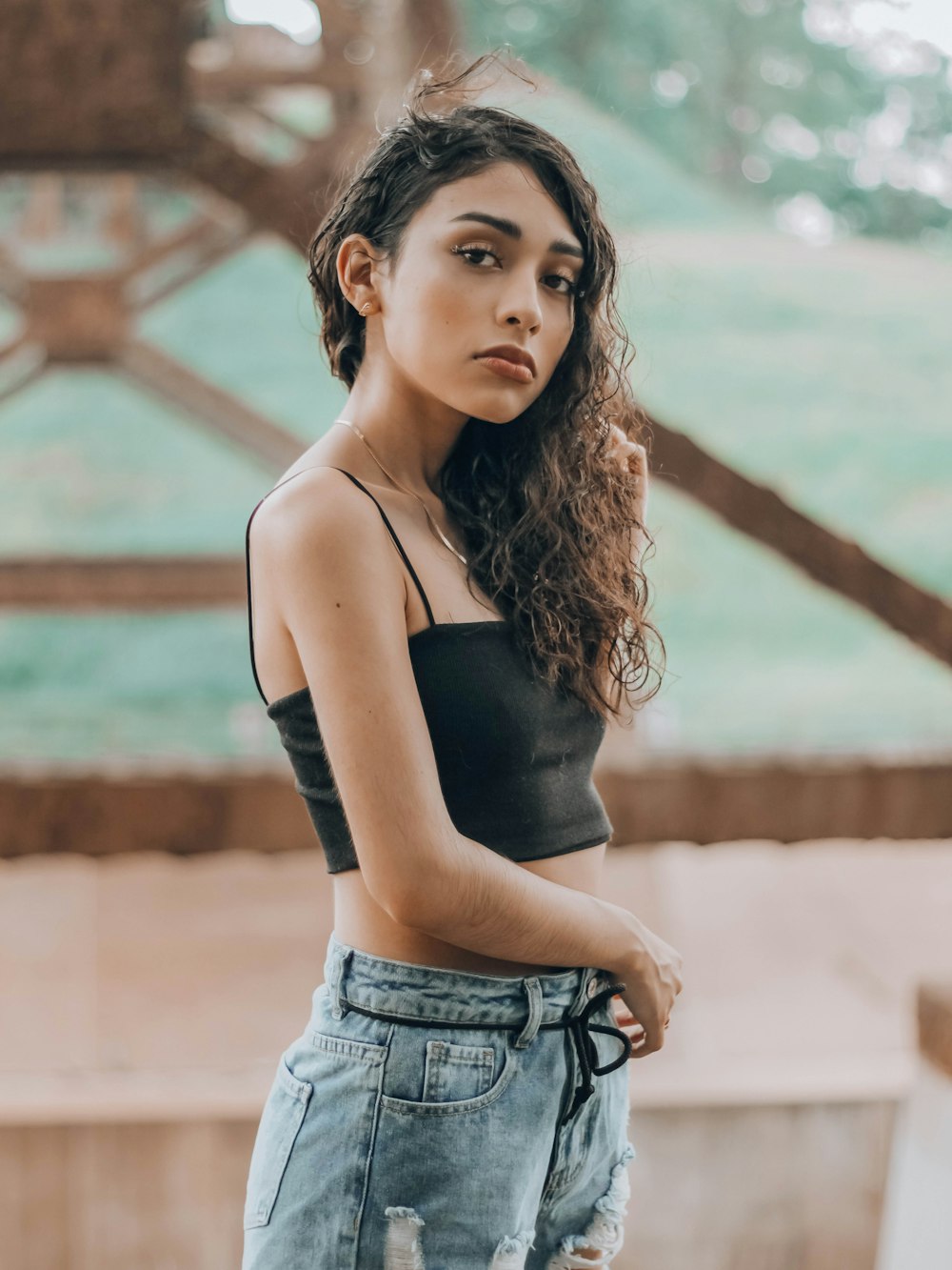 woman in black tank top and blue denim shorts