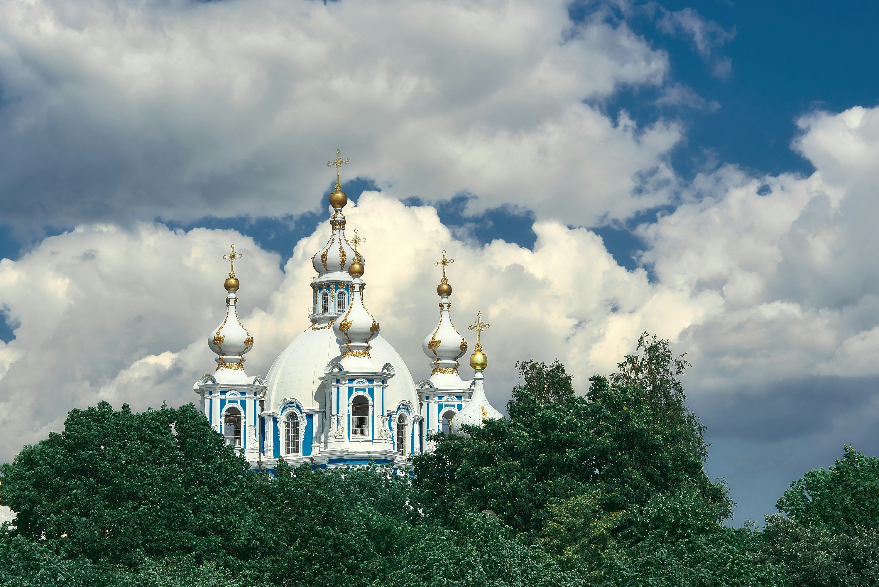 white and gold dome building under cloudy sky during daytime