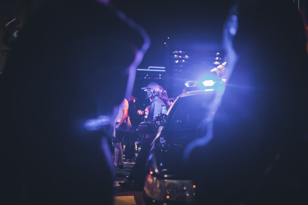 people standing on stage with lights