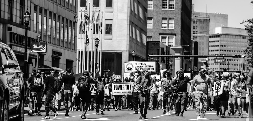 grayscale photo of people walking on street