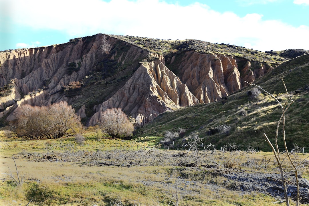 brown rocky mountain under blue sky during daytime