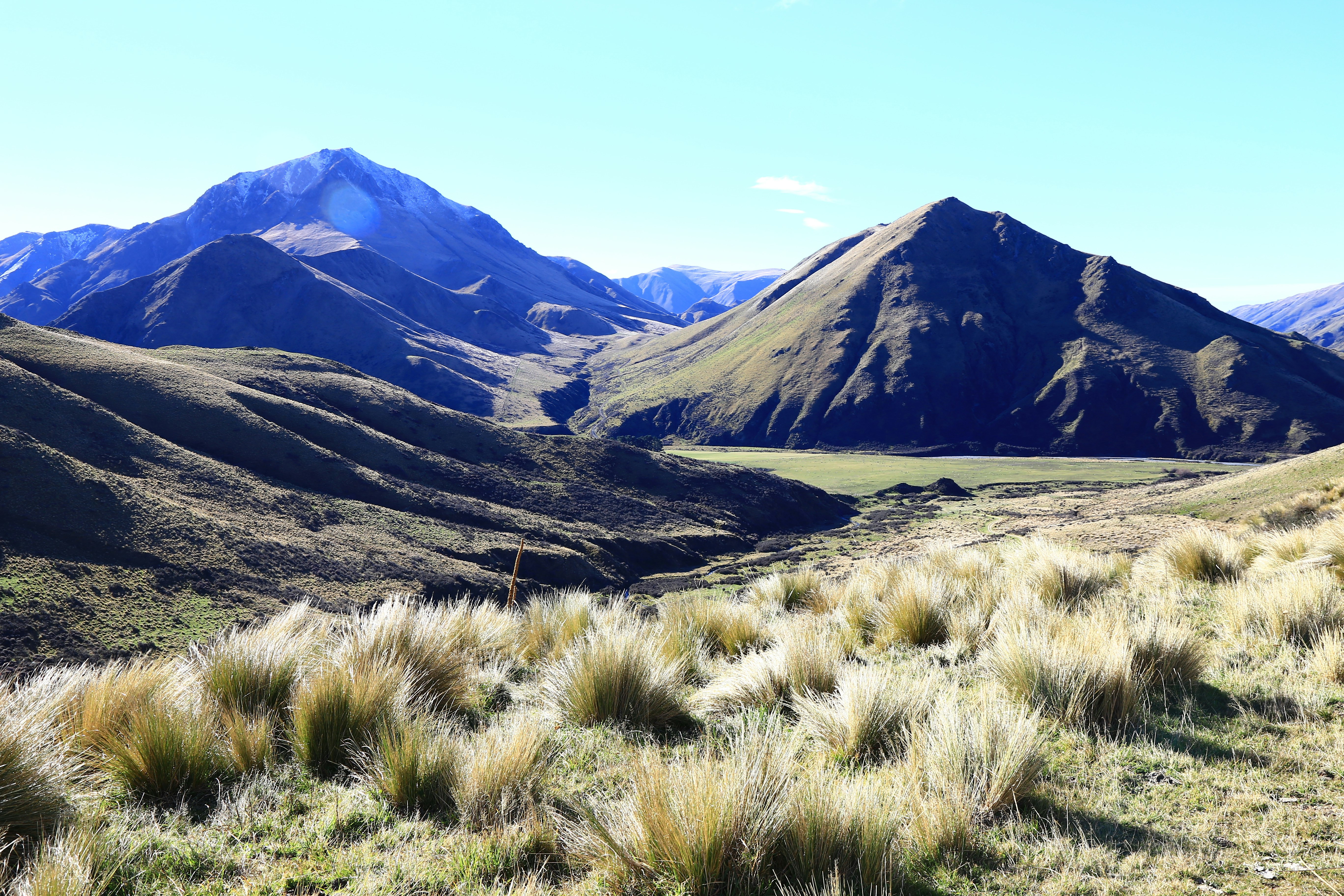 green and brown mountains under blue sky during daytime