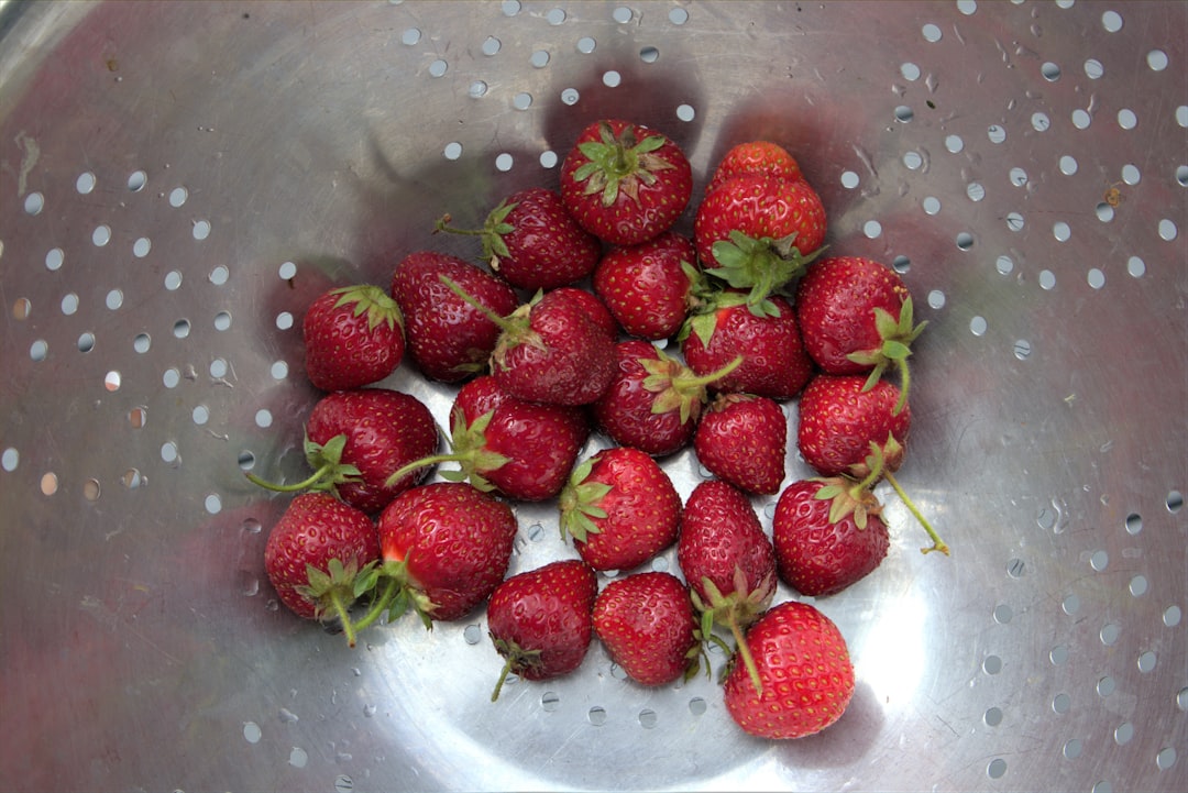 strawberries in stainless steel bowl