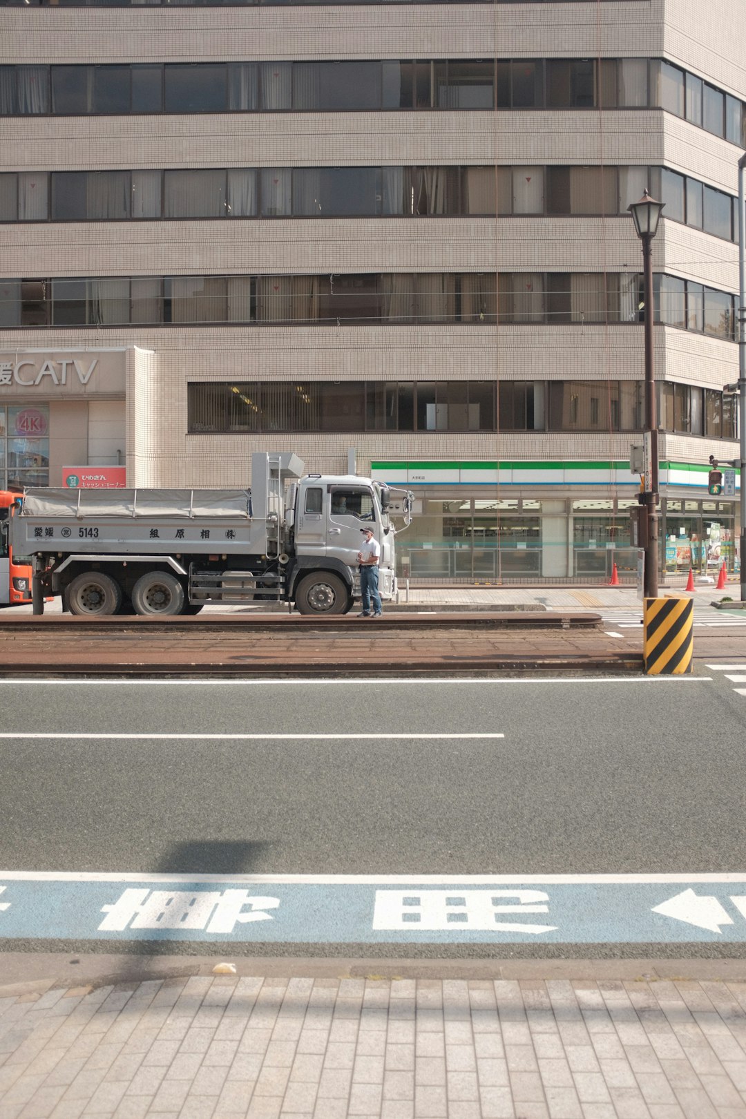 white and brown truck on road near building during daytime