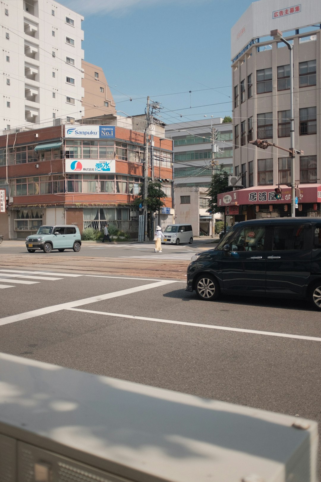 black suv on road during daytime