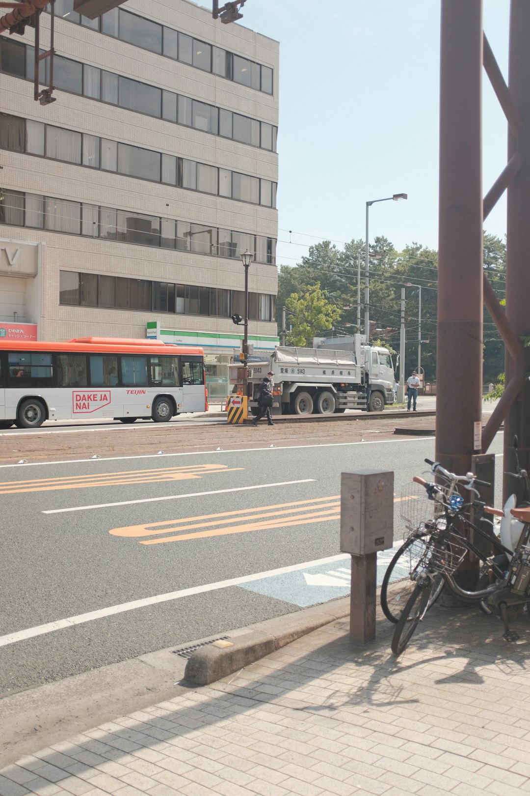 green bus on road during daytime