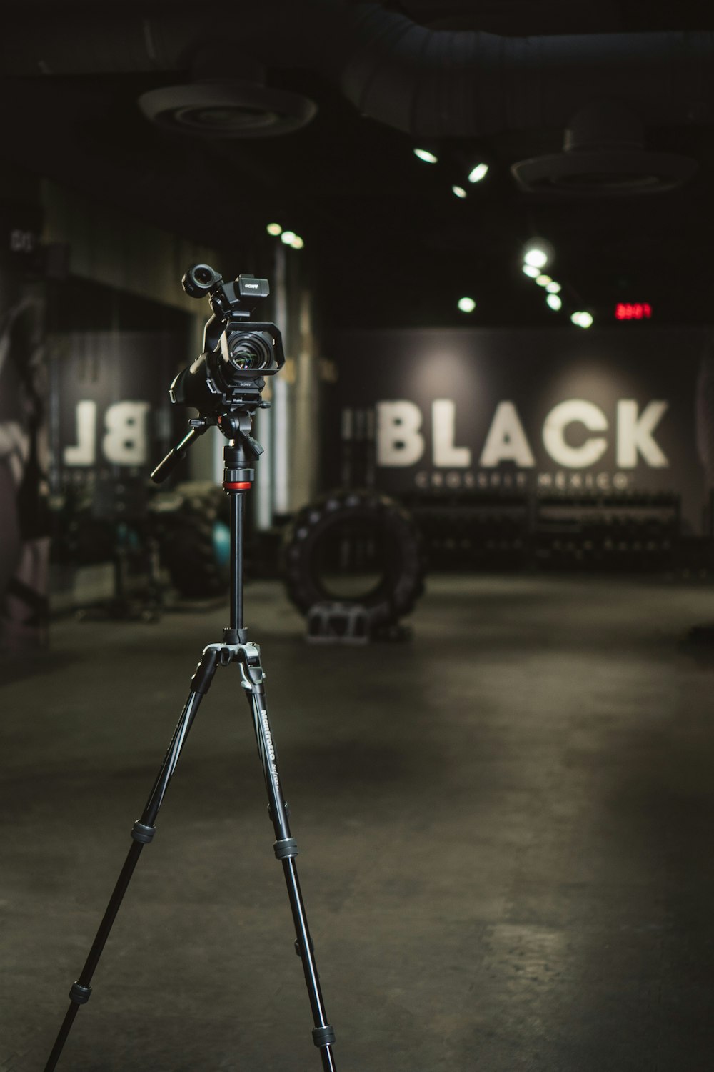 black and gray camera tripod
