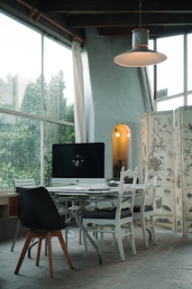 black flat screen tv on white wooden table