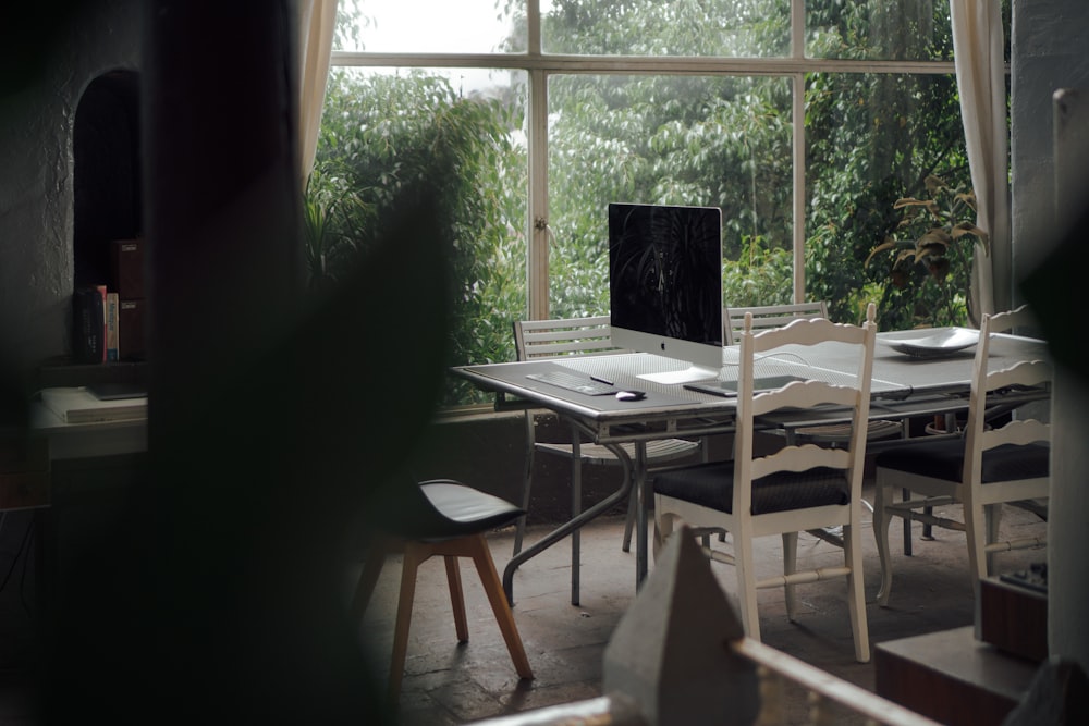 brown wooden table with chairs