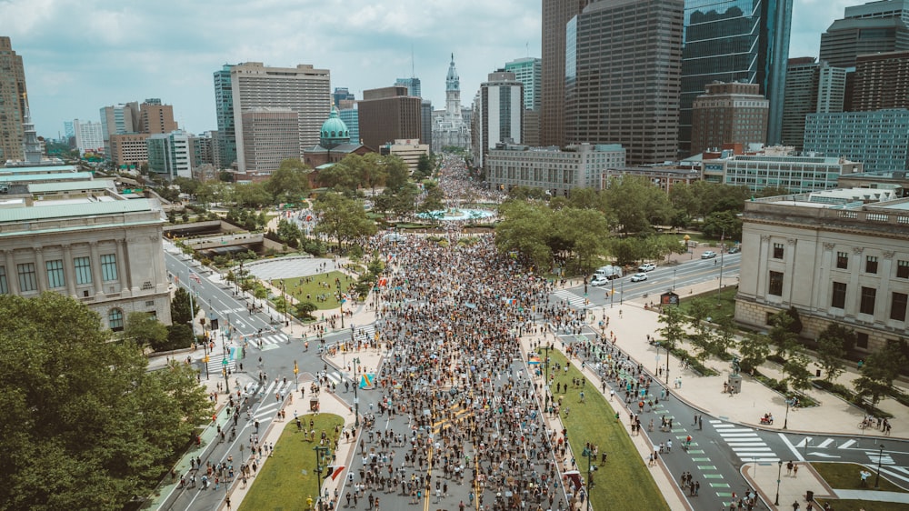 people on park near high rise buildings during daytime