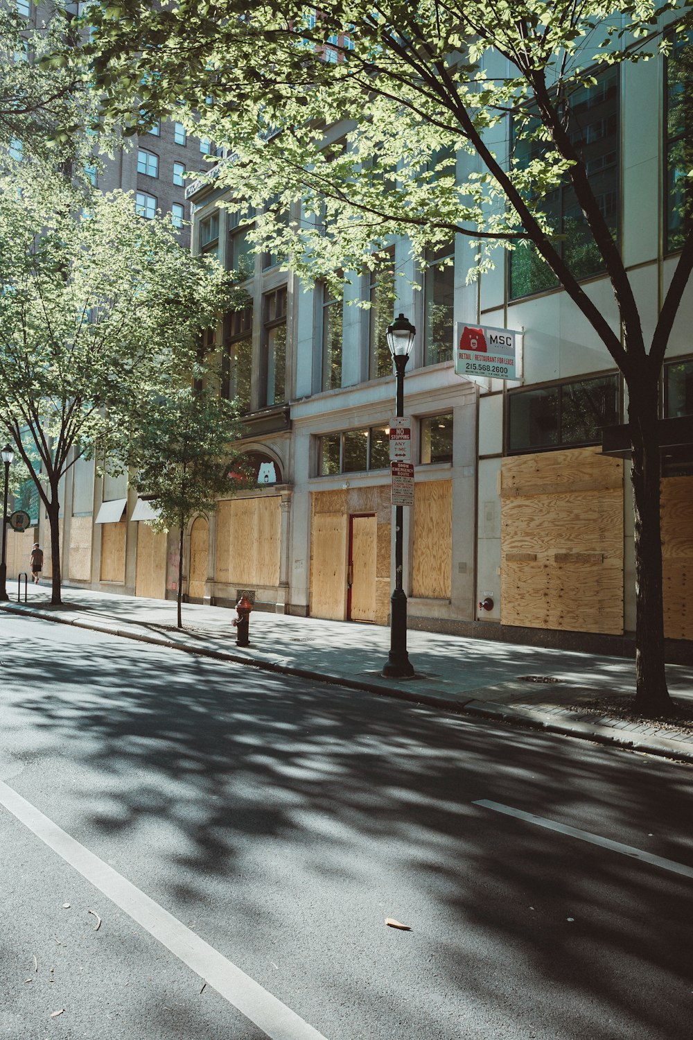 brown concrete building near green trees during daytime