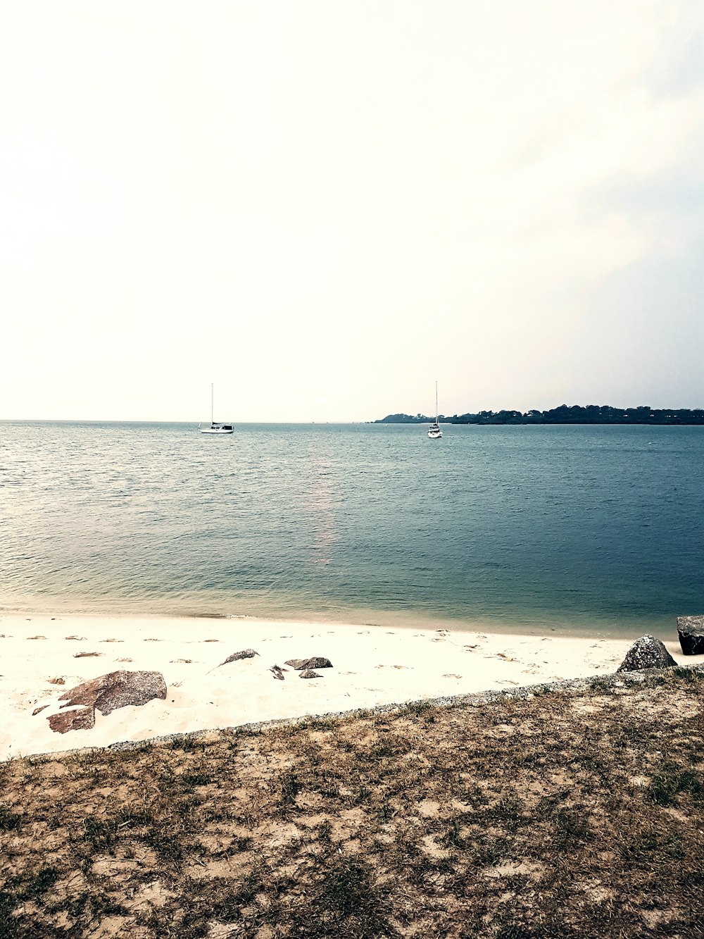 body of water under cloudy sky during daytime