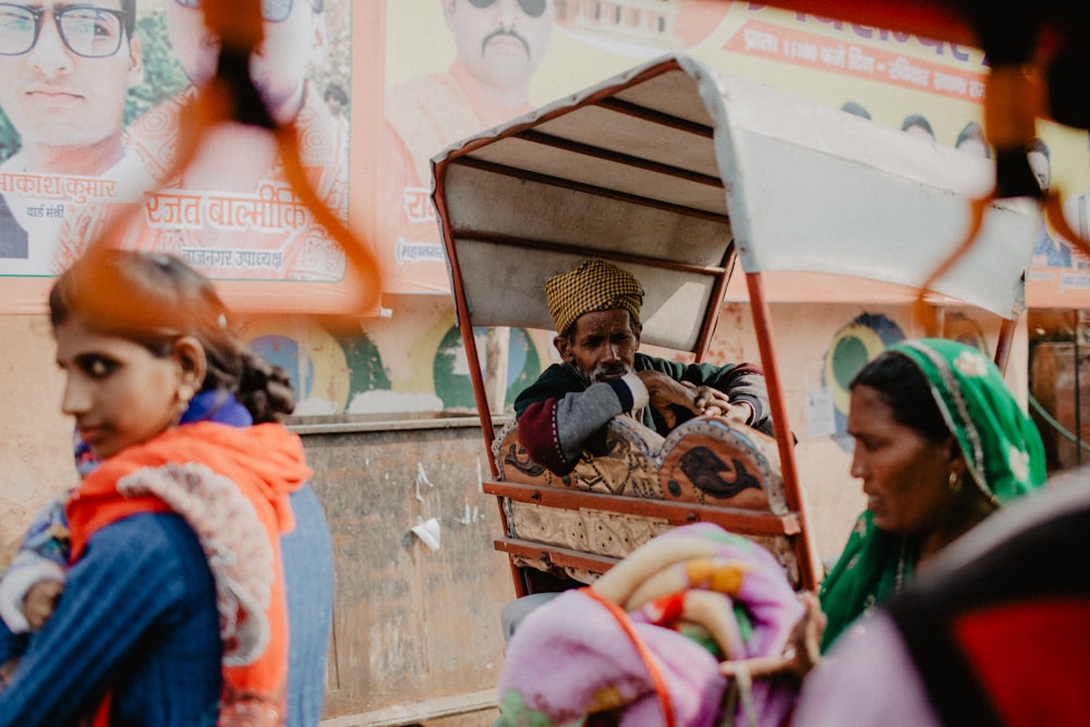 woman in green shirt carrying baby in stroller