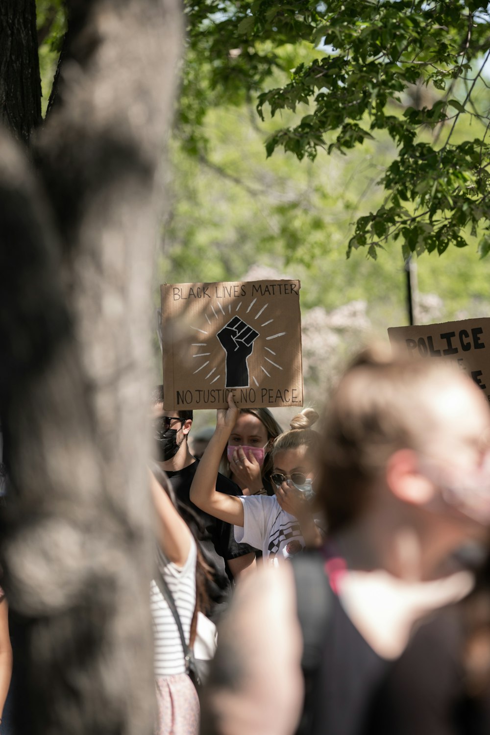 people holding brown wooden board during daytime