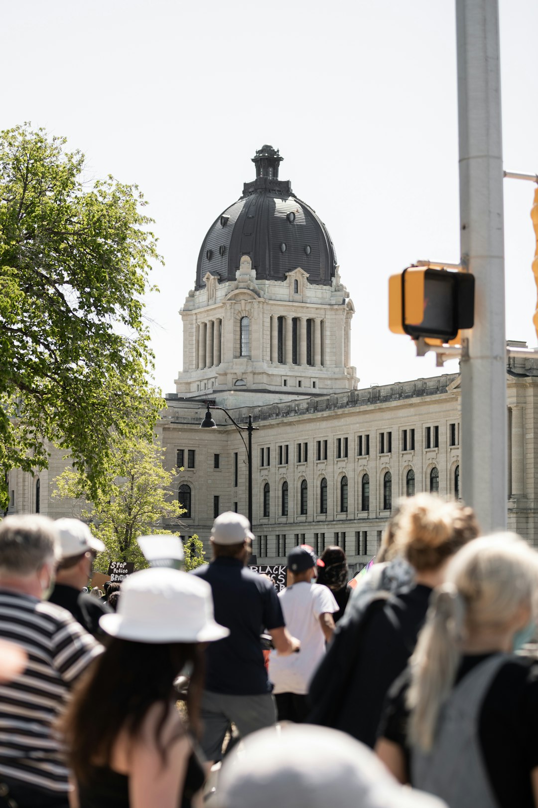 people walking near gray concrete building during daytime