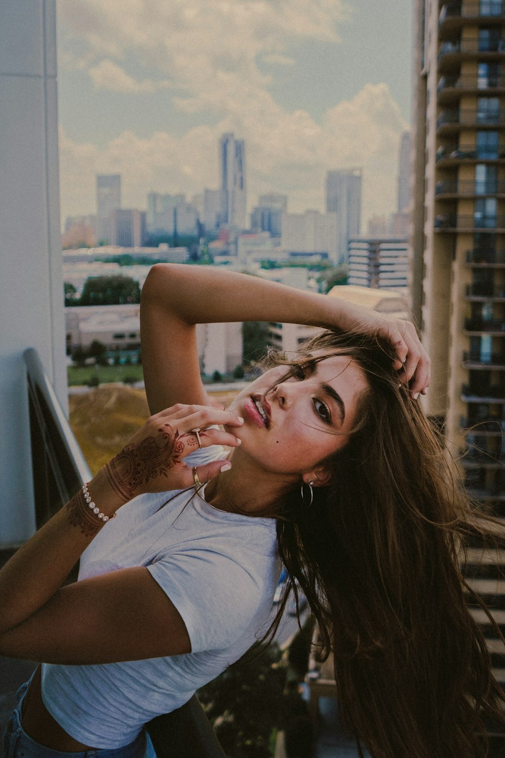 woman in white tank top sitting on chair