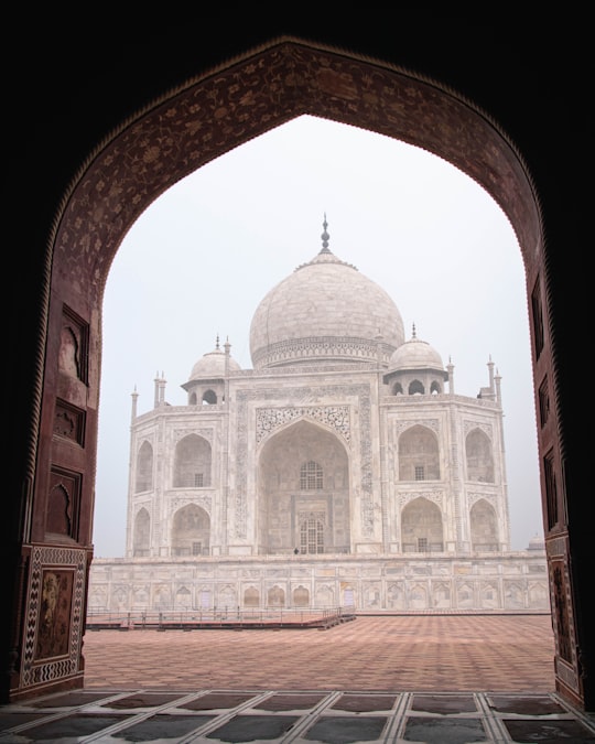 brown and white concrete building in Taj Mahal India