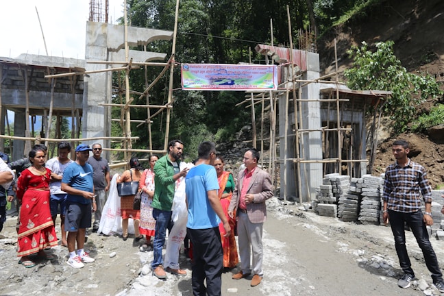 Community members gathered around a methane bio-cover installation site.