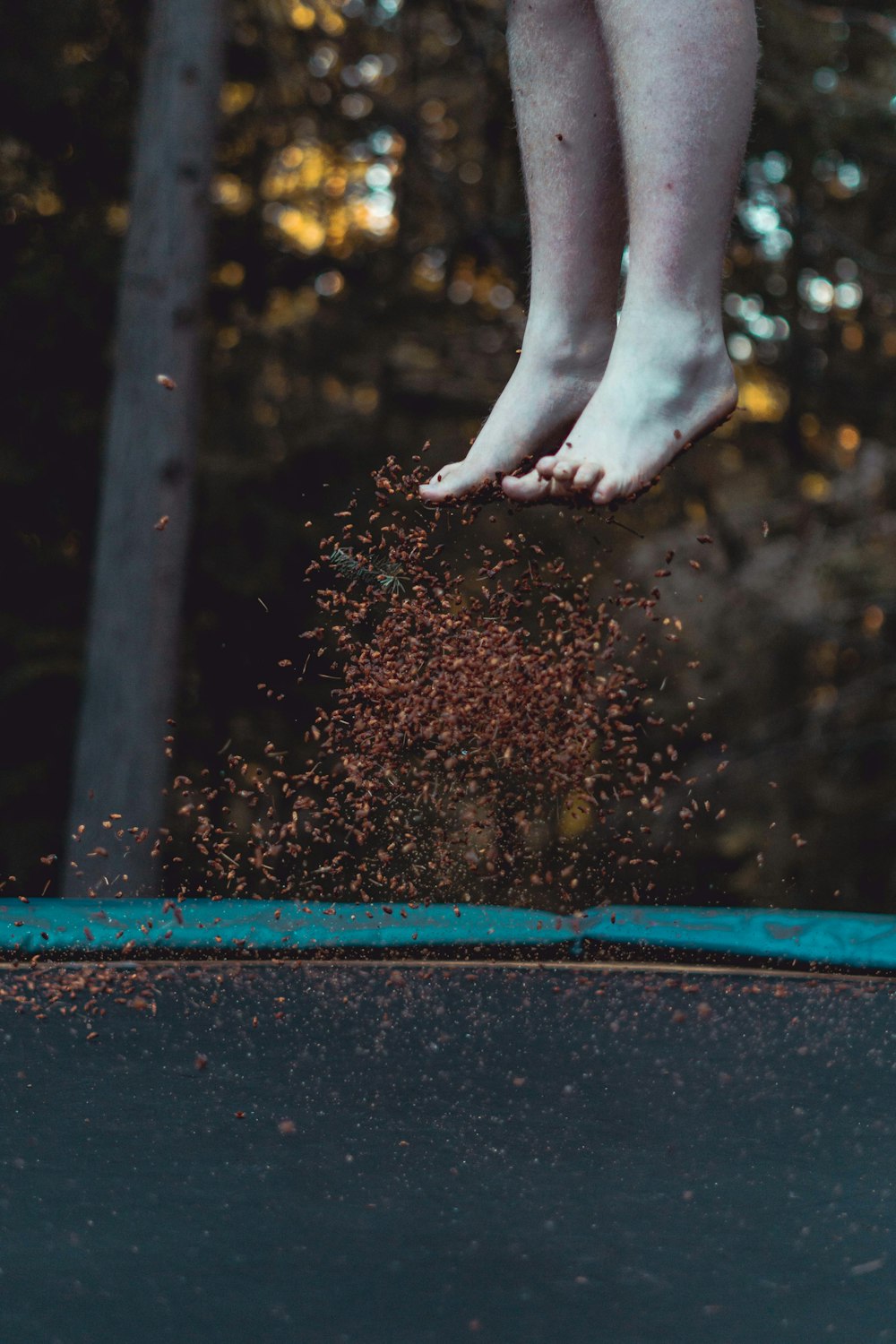 person standing on blue and red metal frame