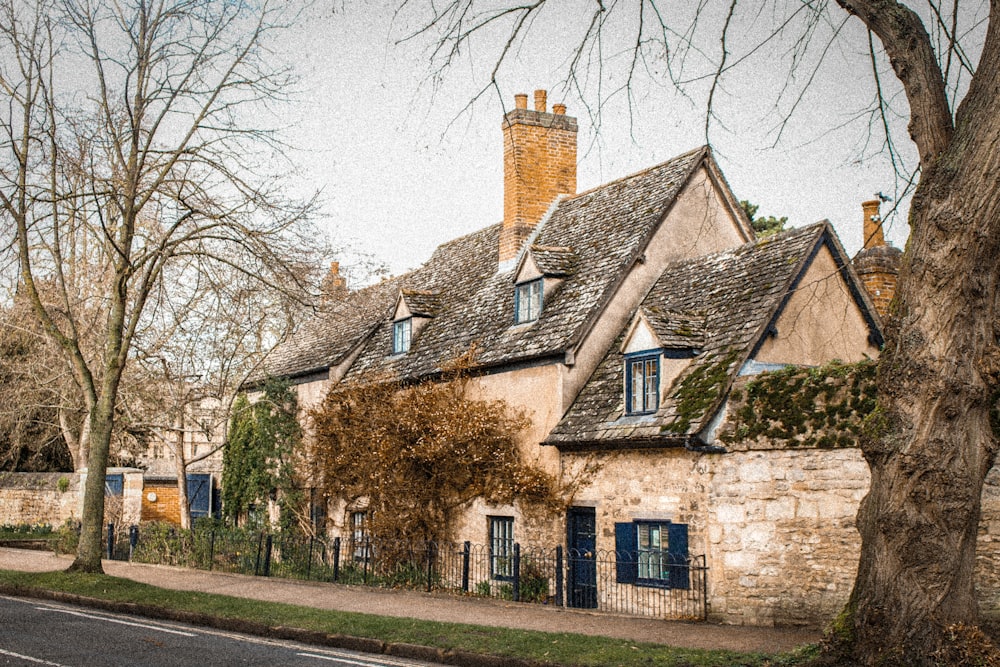 brown brick building near bare trees during daytime