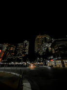 An evening cityscape shot showing soft glowing lights and a quiet rooftop workspace.