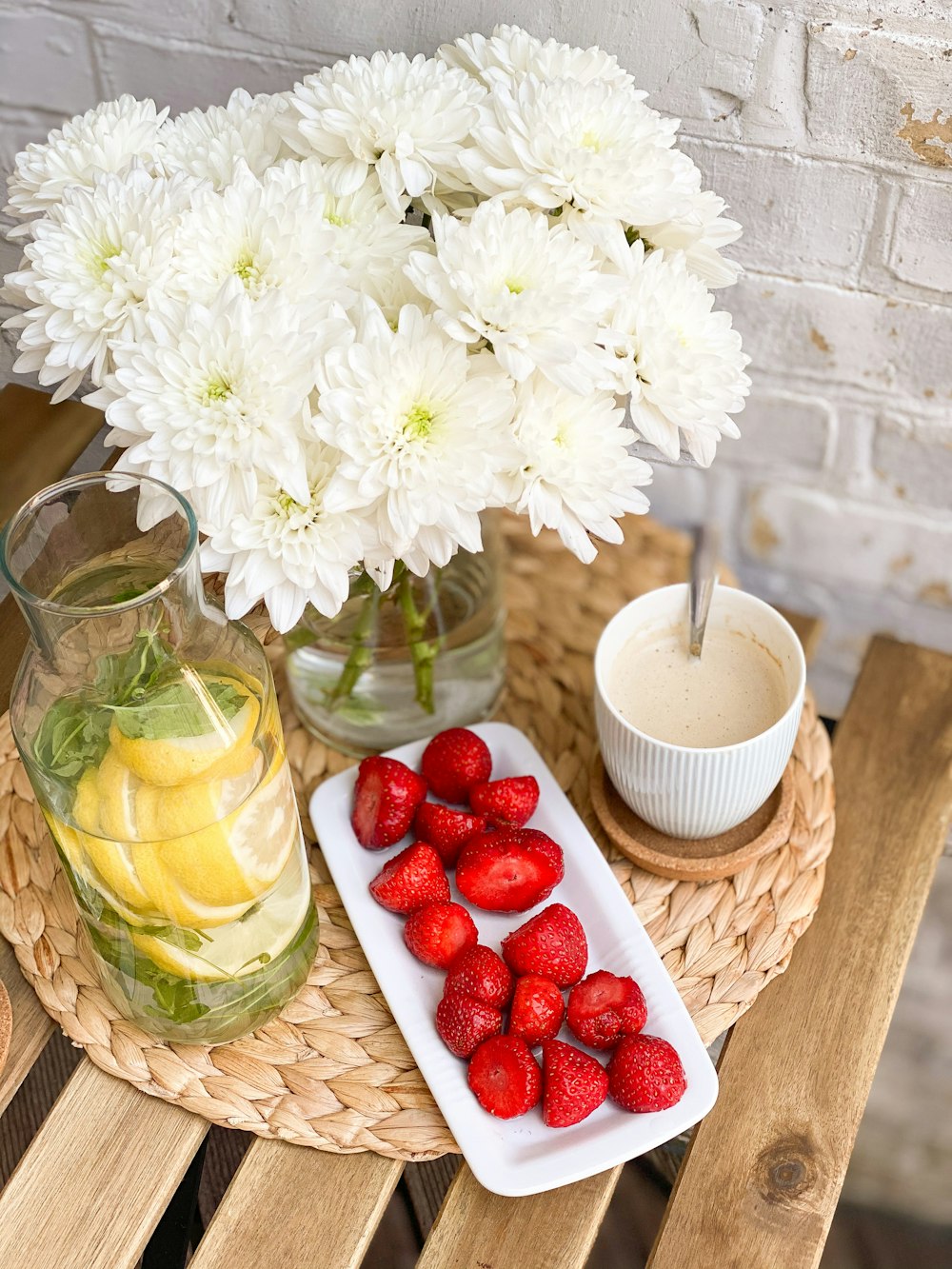 white flowers in clear glass vase