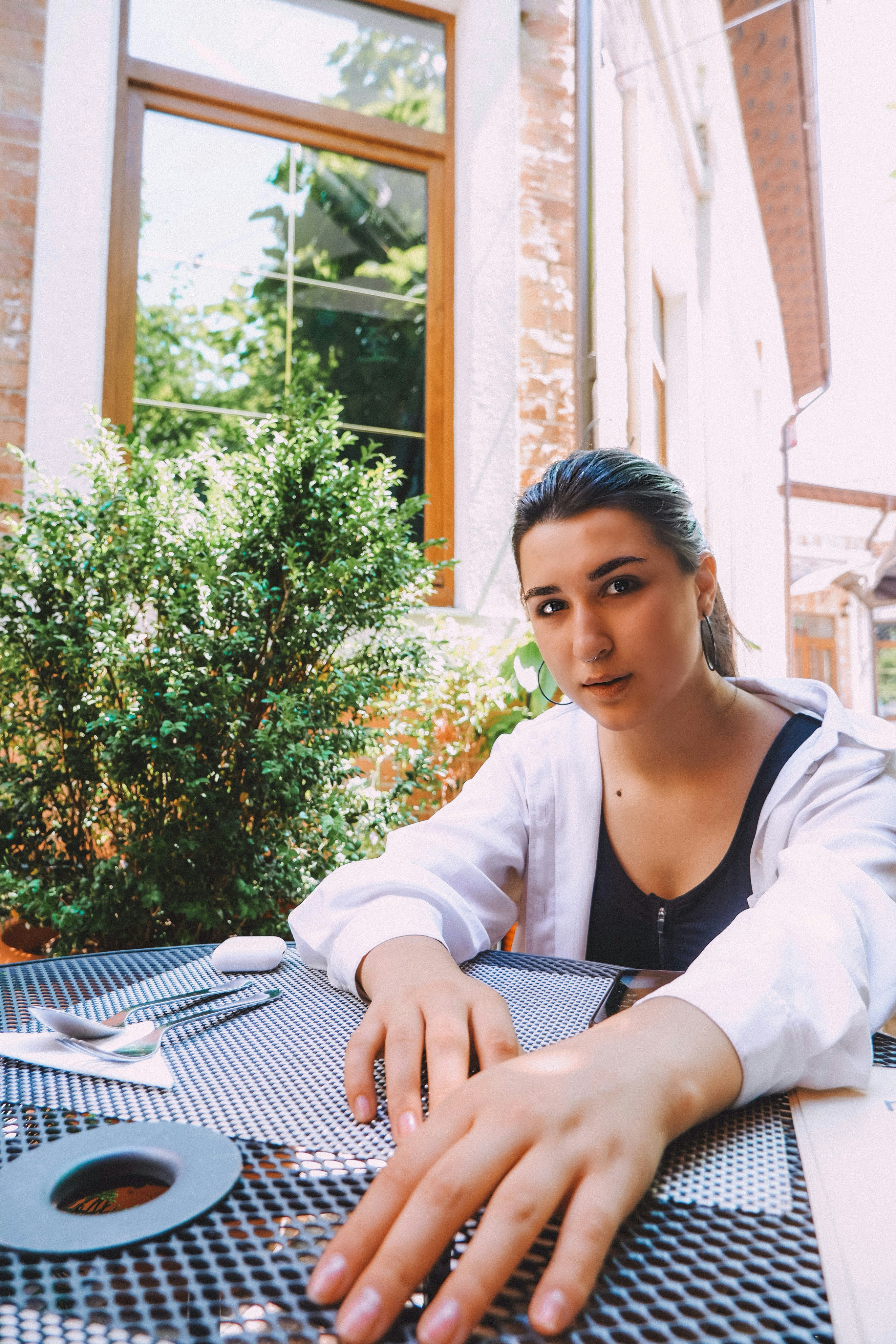 woman in white long sleeve shirt sitting on chair