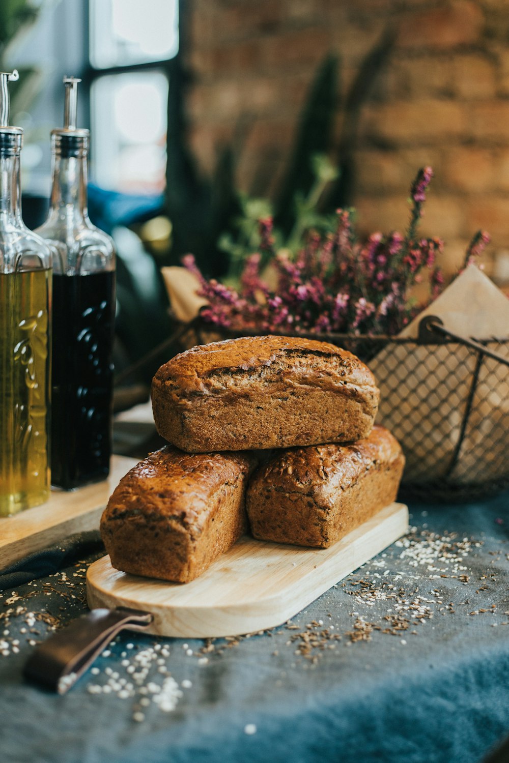 bread on white ceramic plate beside glass bottle