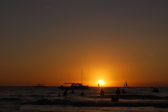 silhouette of boat on sea during sunset in Boracay Philippines