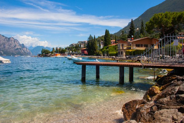 Brown wooden dock on sea during daytime — Lake Garda, Italy