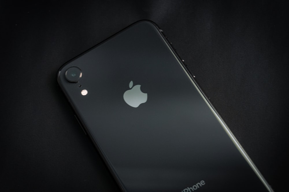 black iphone 7 plus on black textile