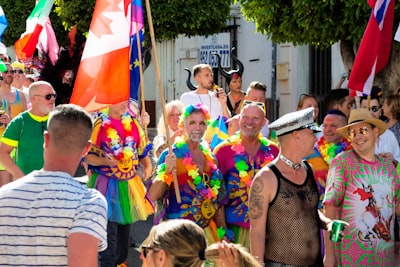 group of people standing on street during daytime garland teams background