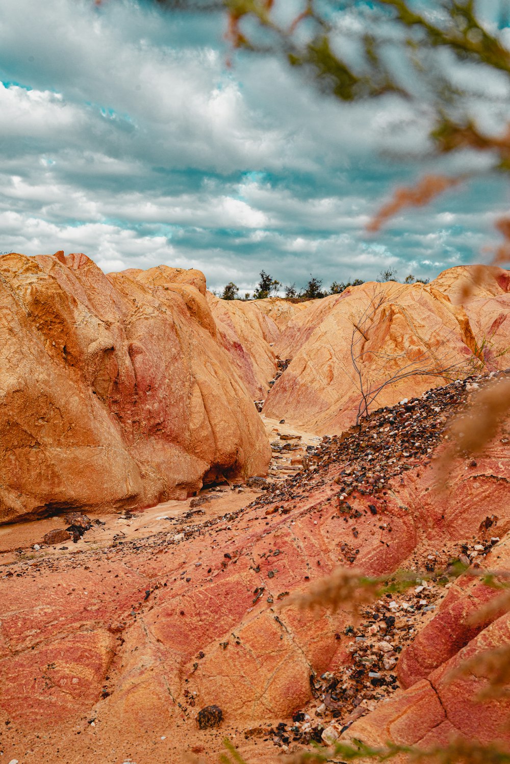 brown rocky mountain under cloudy sky during daytime