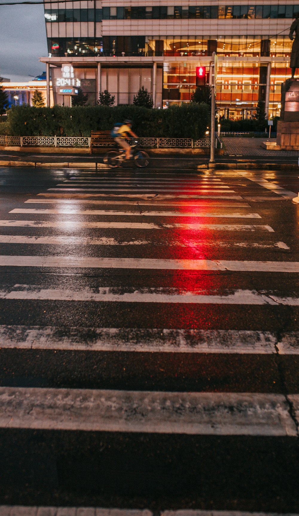 a crosswalk with a red light at night