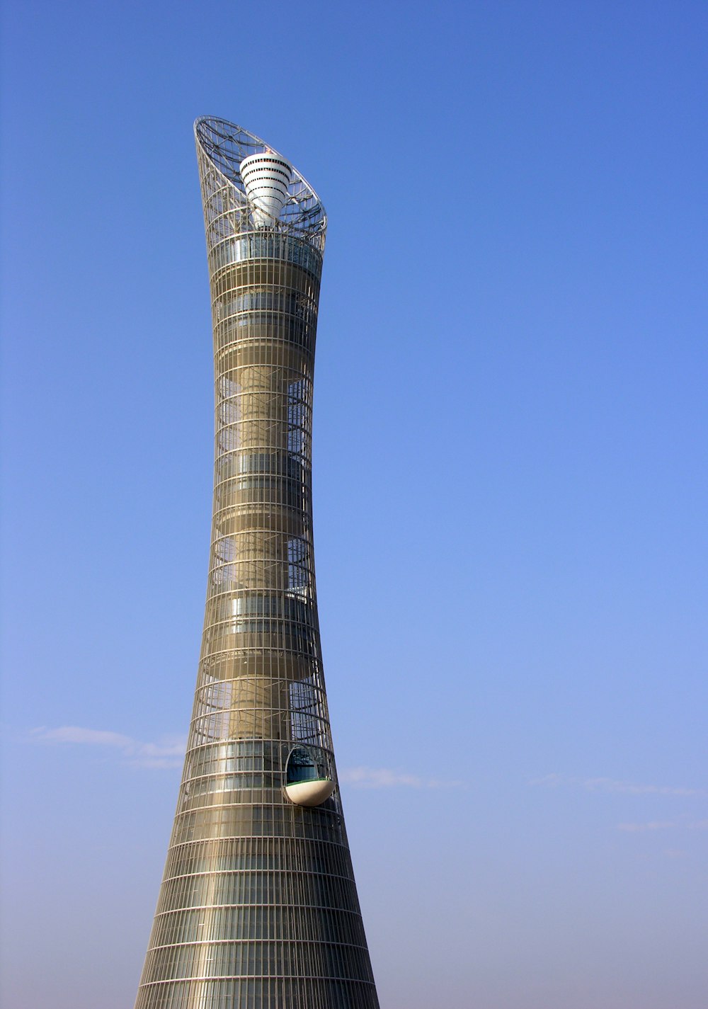 gray and black tower under blue sky during daytime