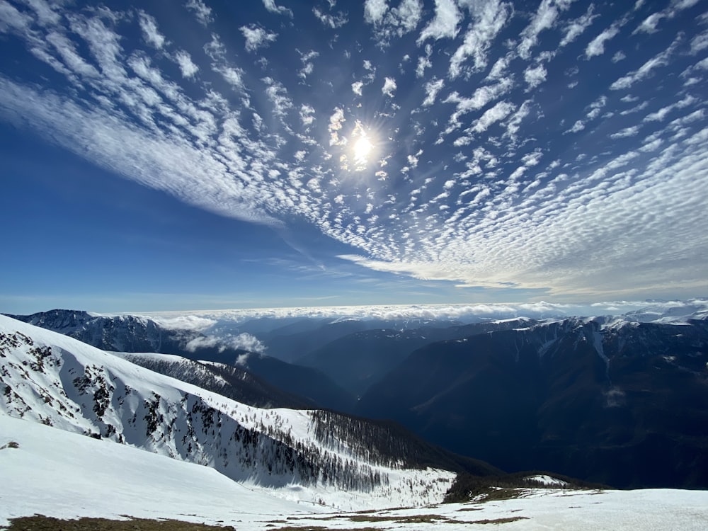 snow covered mountain under blue sky during daytime