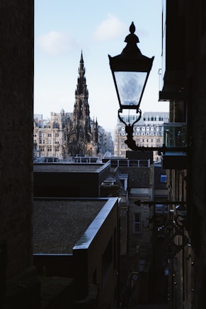 black street light near high rise buildings during daytime