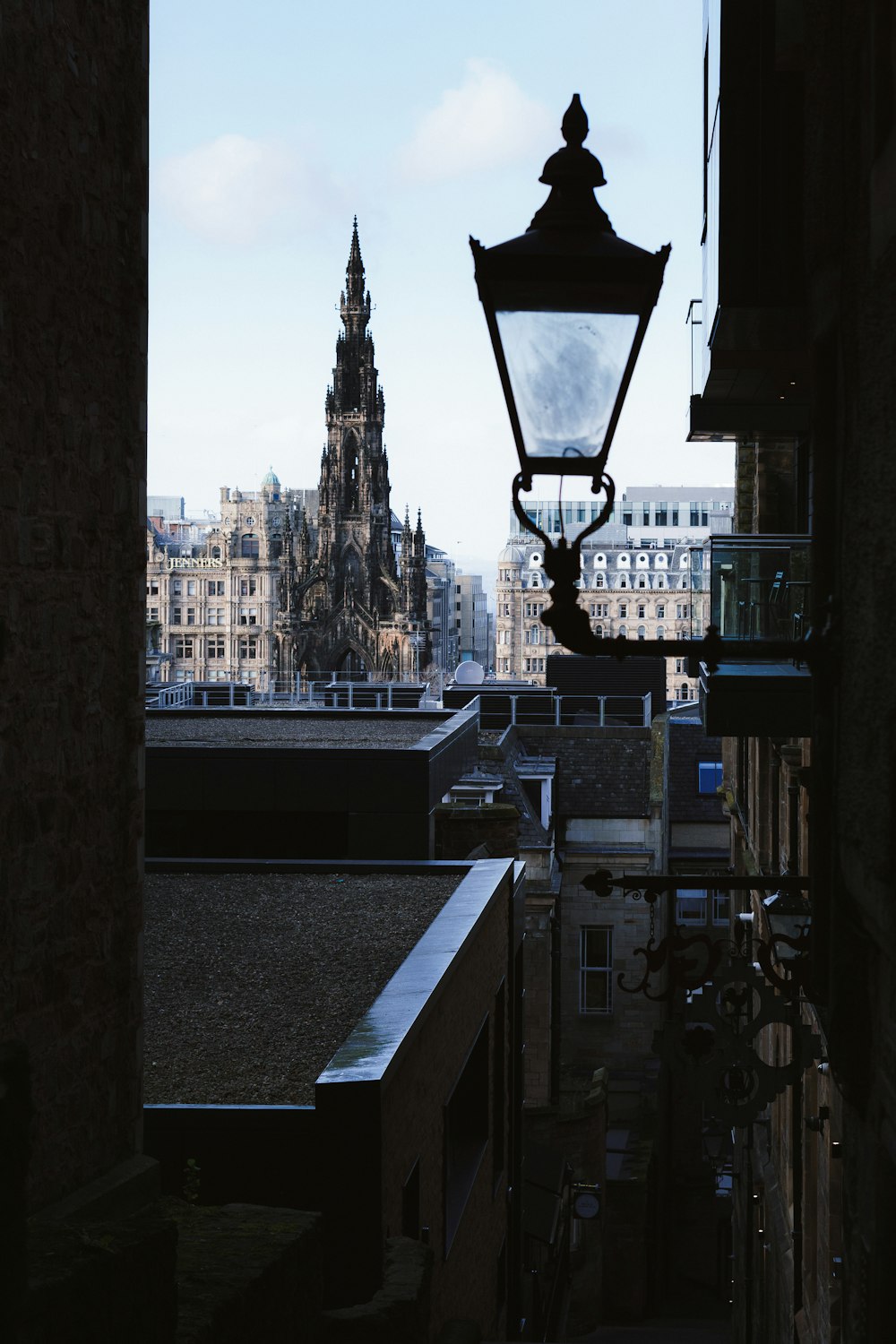 black street light near high rise buildings during daytime