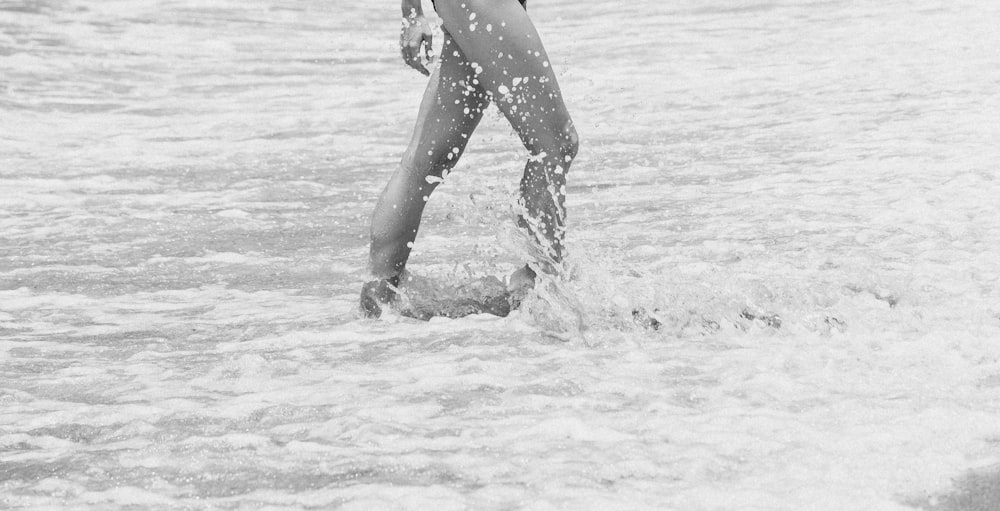 grayscale photo of woman in water