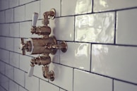 Close-up of a polished chrome shower valve and fixtures, demonstrating attention to detail and quality.