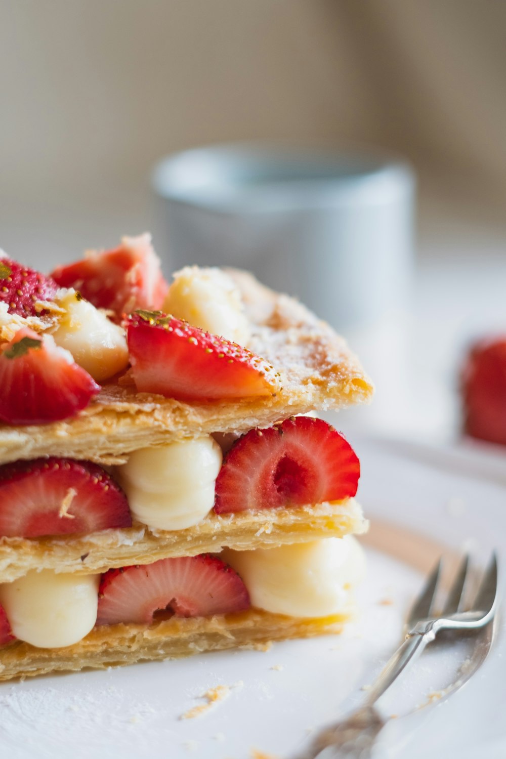 sliced strawberries on white ceramic plate