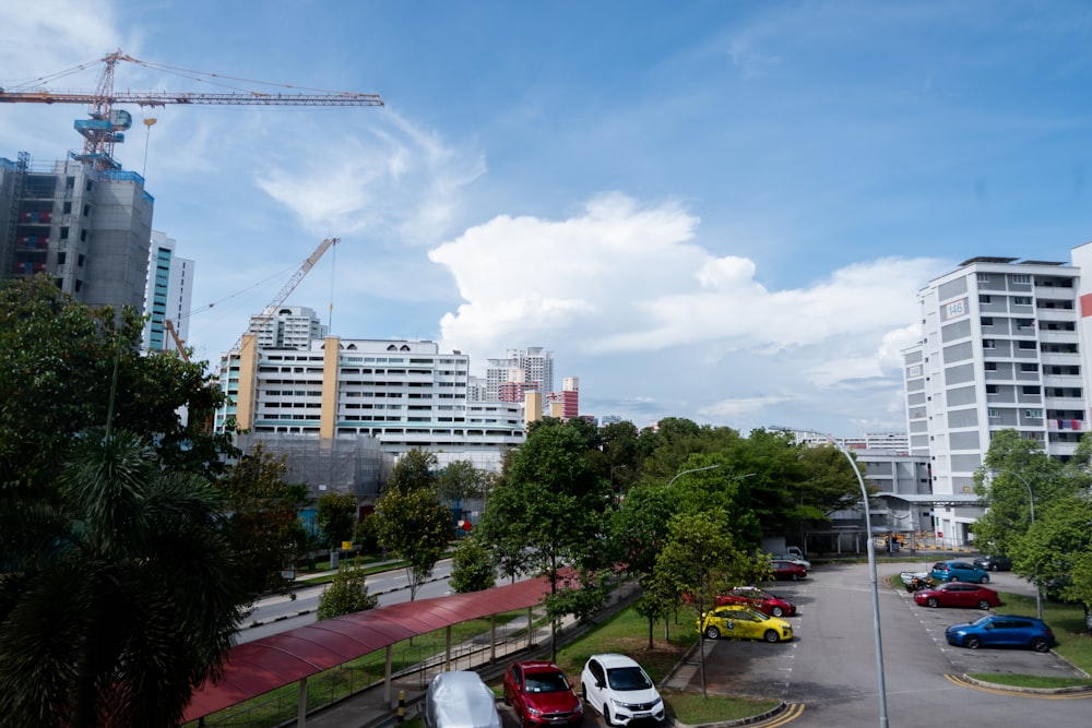 cars parked on parking lot near buildings during daytime