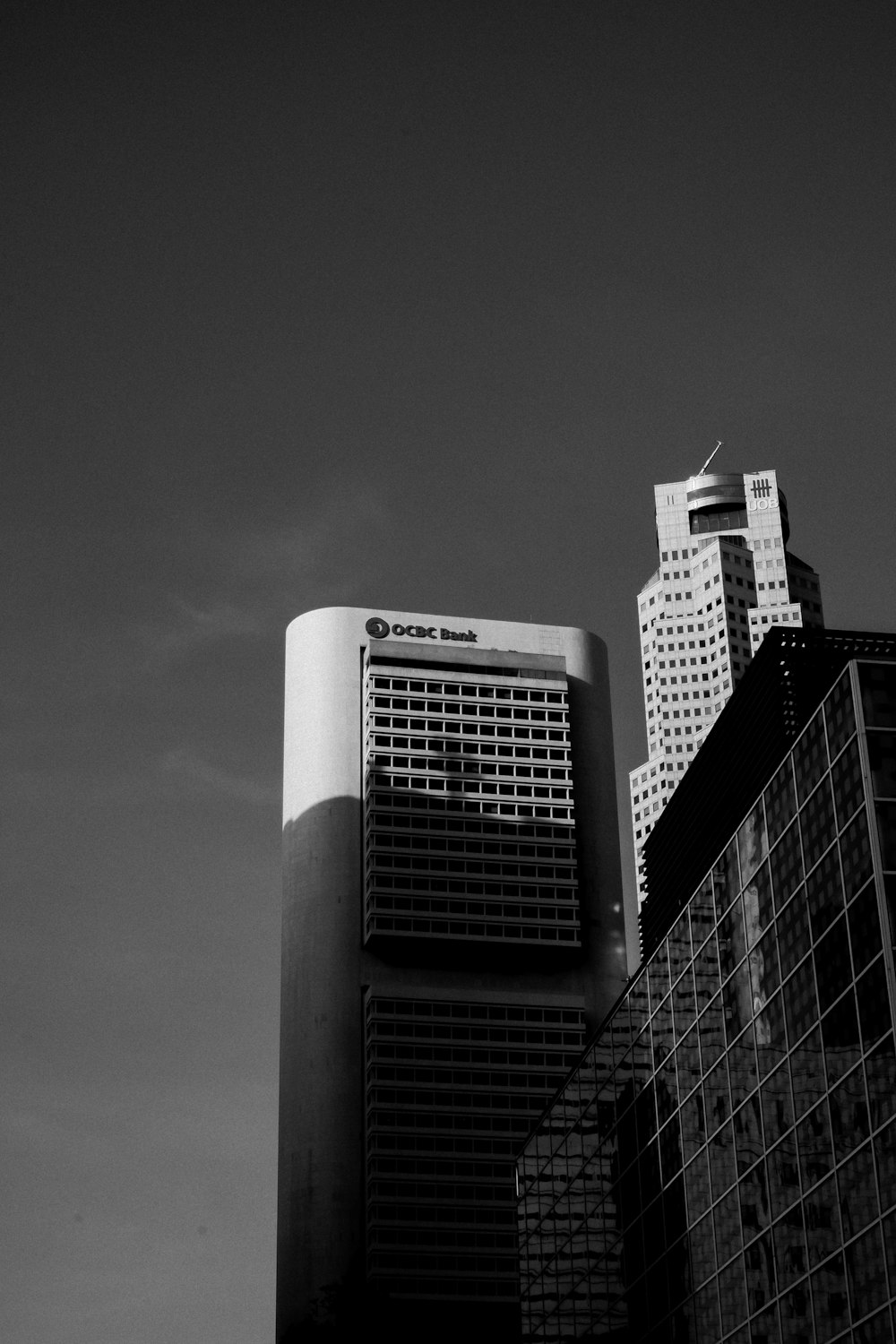 grayscale photo of high rise buildings