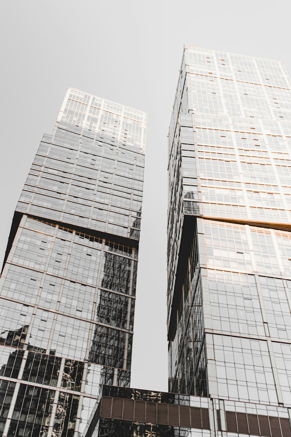 black and white glass walled high rise building