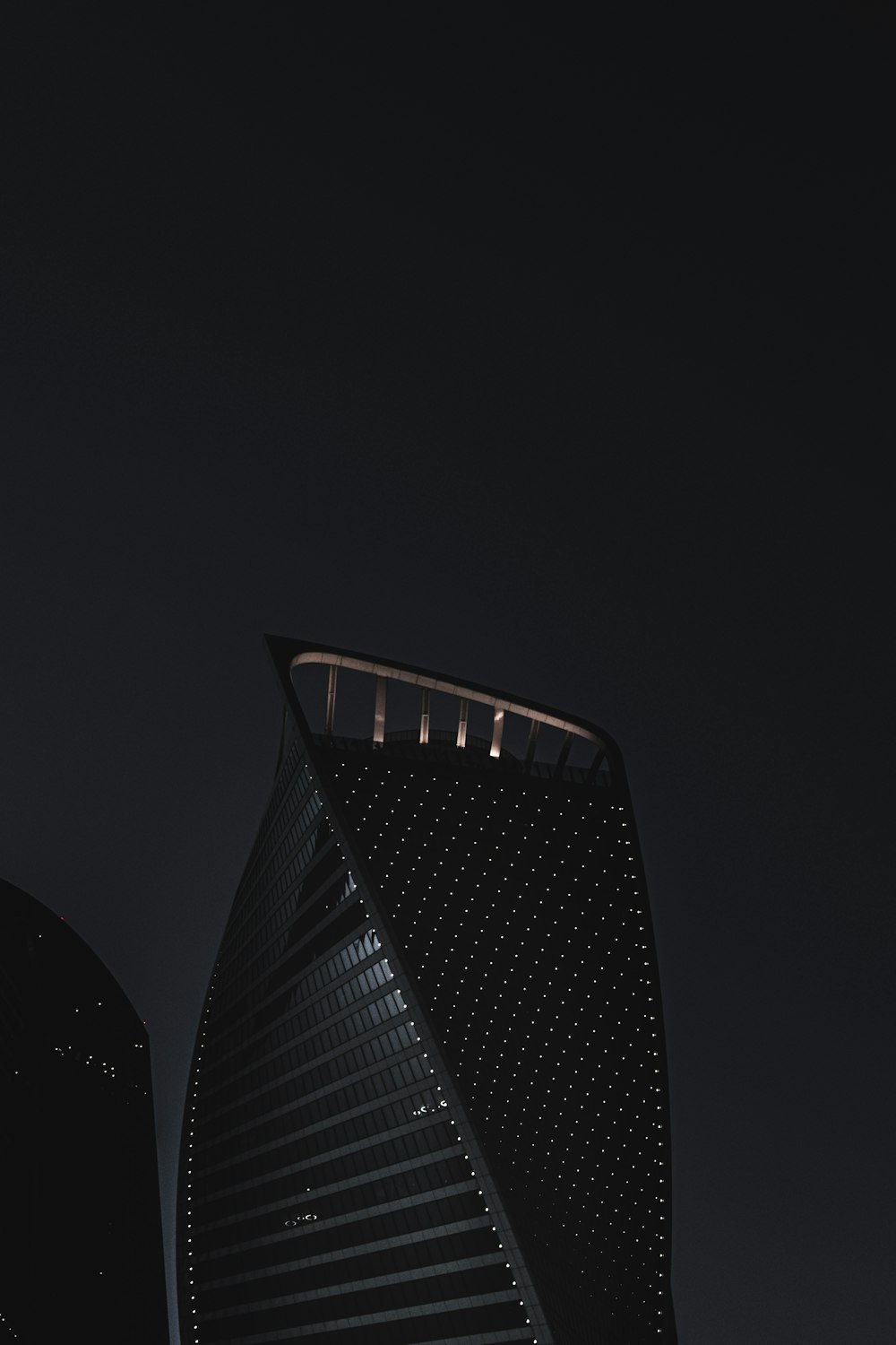 black high rise building during night time